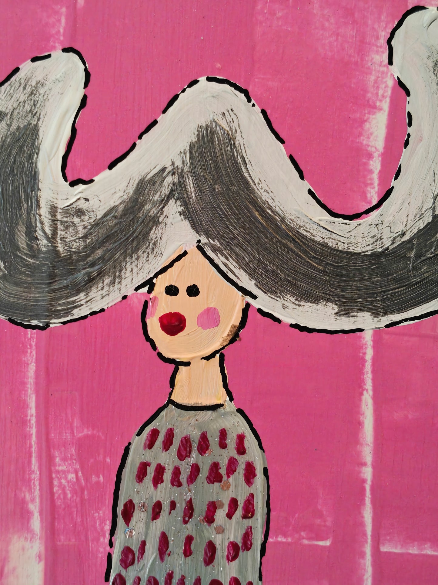 Close up of Pop art painting of a woman with large flyaway hair and a silvery dress with red spots on. The background of the painting is bright pink.