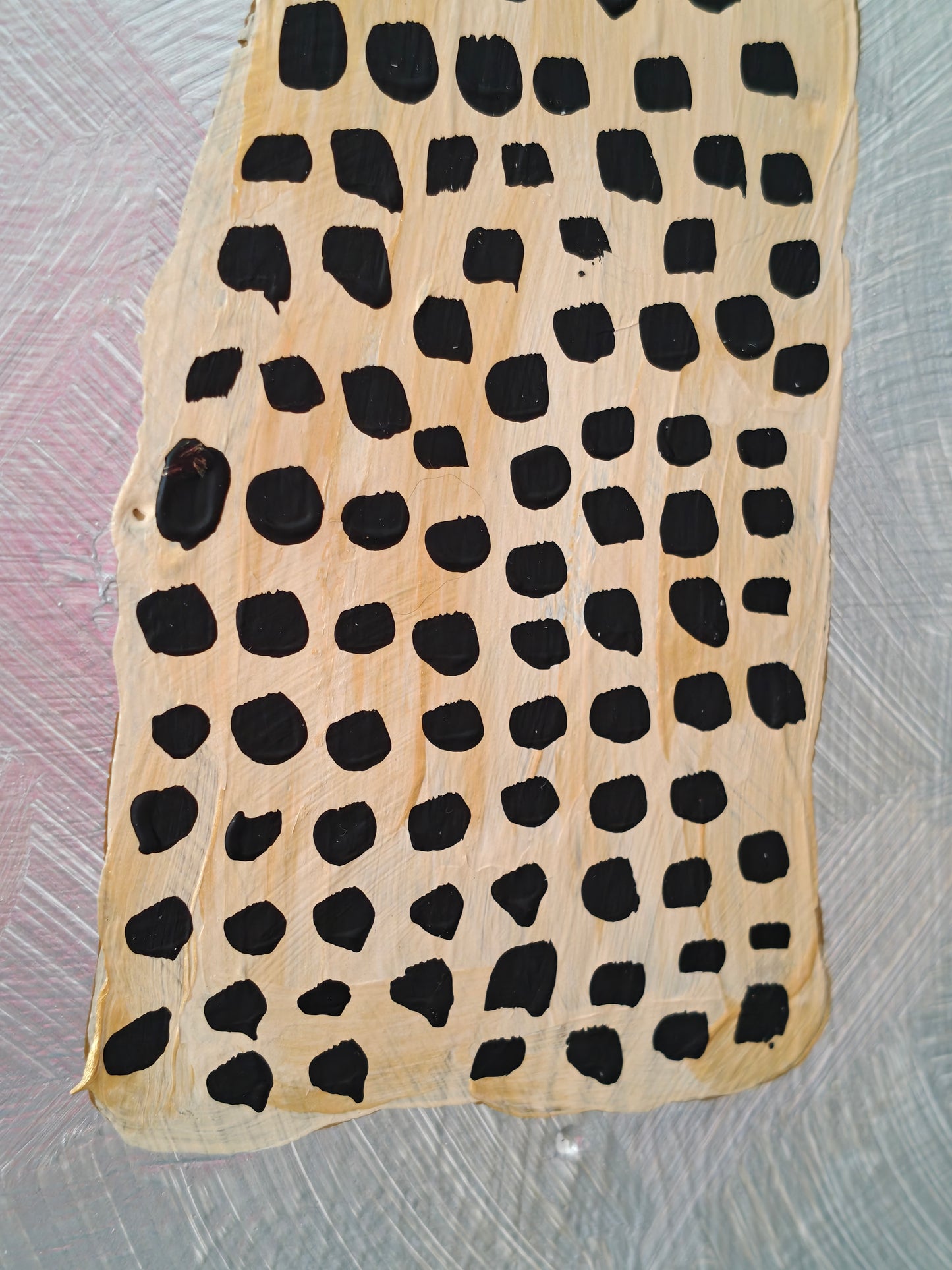 Close up of Abstract painting of a stylized woman with a spotted dress, and a textured silver background, titled Goldilocks 2.0.