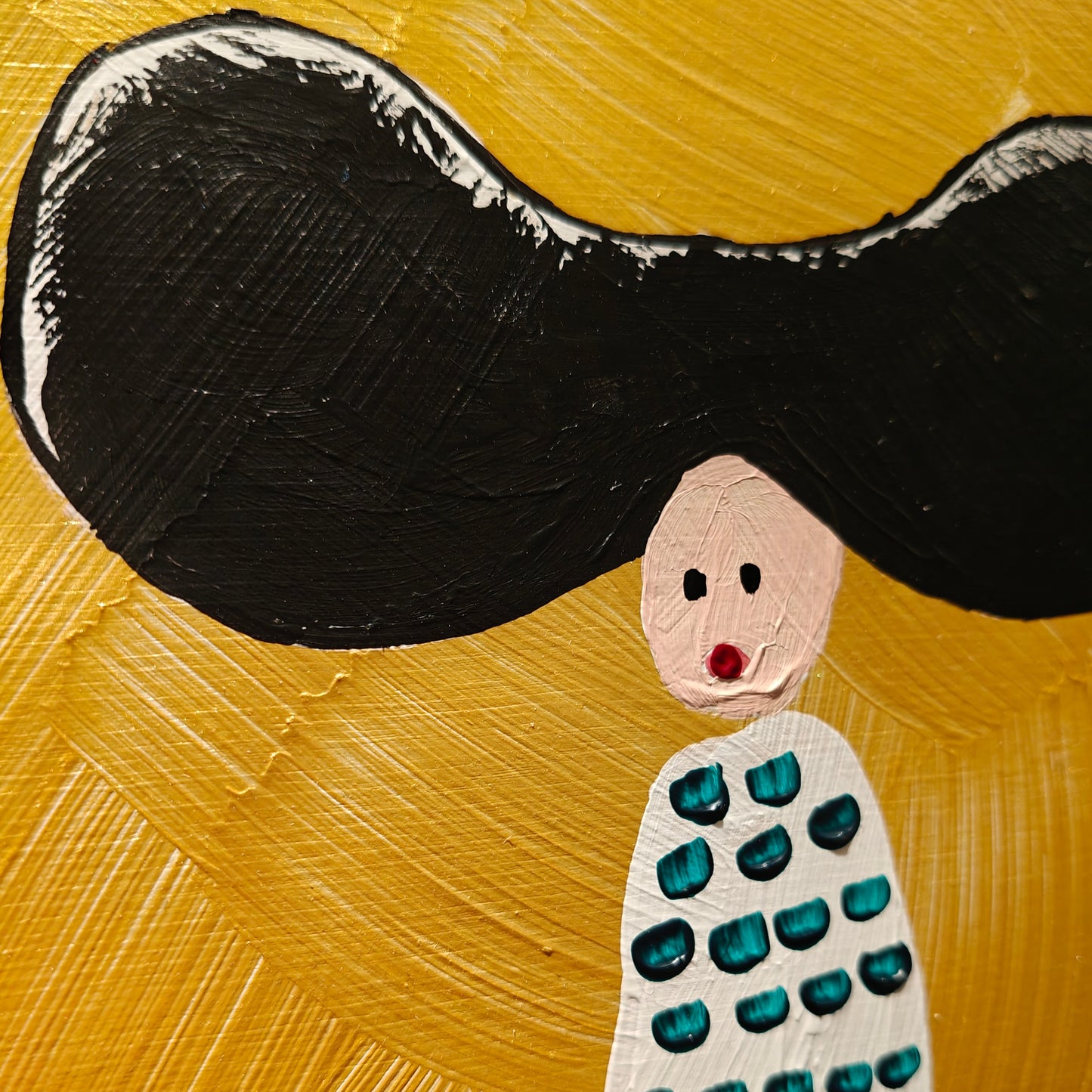 Close up of Acrylic painting on birch plywood depicting a woman with large black hair against a gold backdrop. She's wearing a white dress with green dots.
