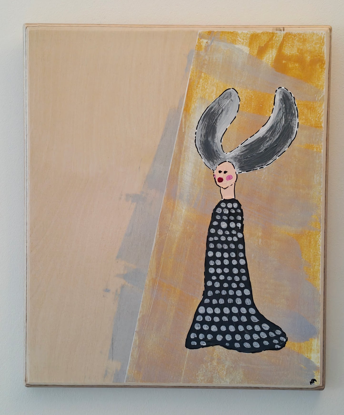 Pop art painting of a woman with large flyaway hair and a black dress with silver spots on. The background of the painting is silver and yellow. The artwork has been painted on birch plywood and it's hung on a white wall.