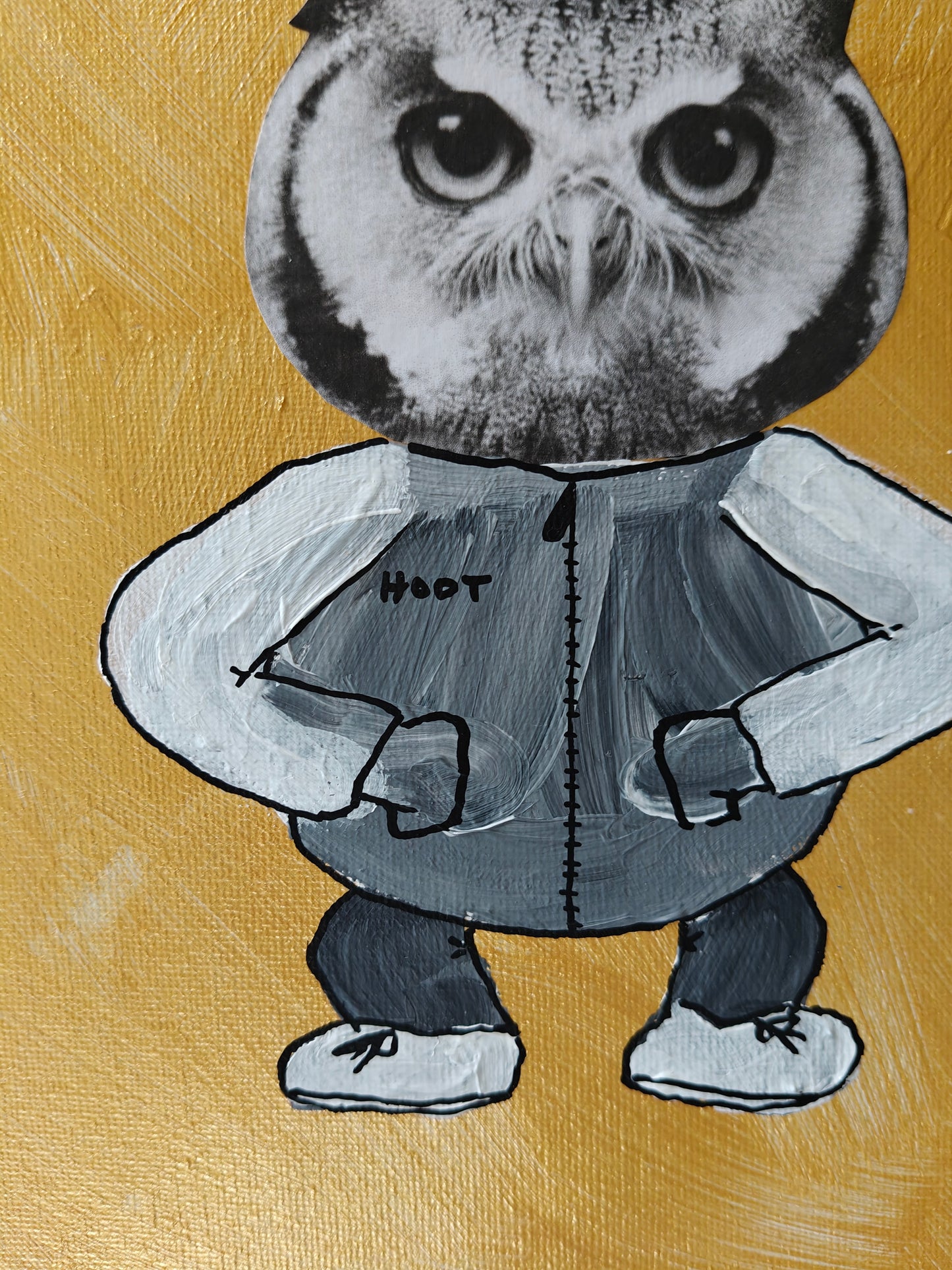 Close up of a Playful mixed media painting of an owl dressed in a jacket, trousers and trainers. The jacket has the word "hoot" written on the chest. The background is golden.