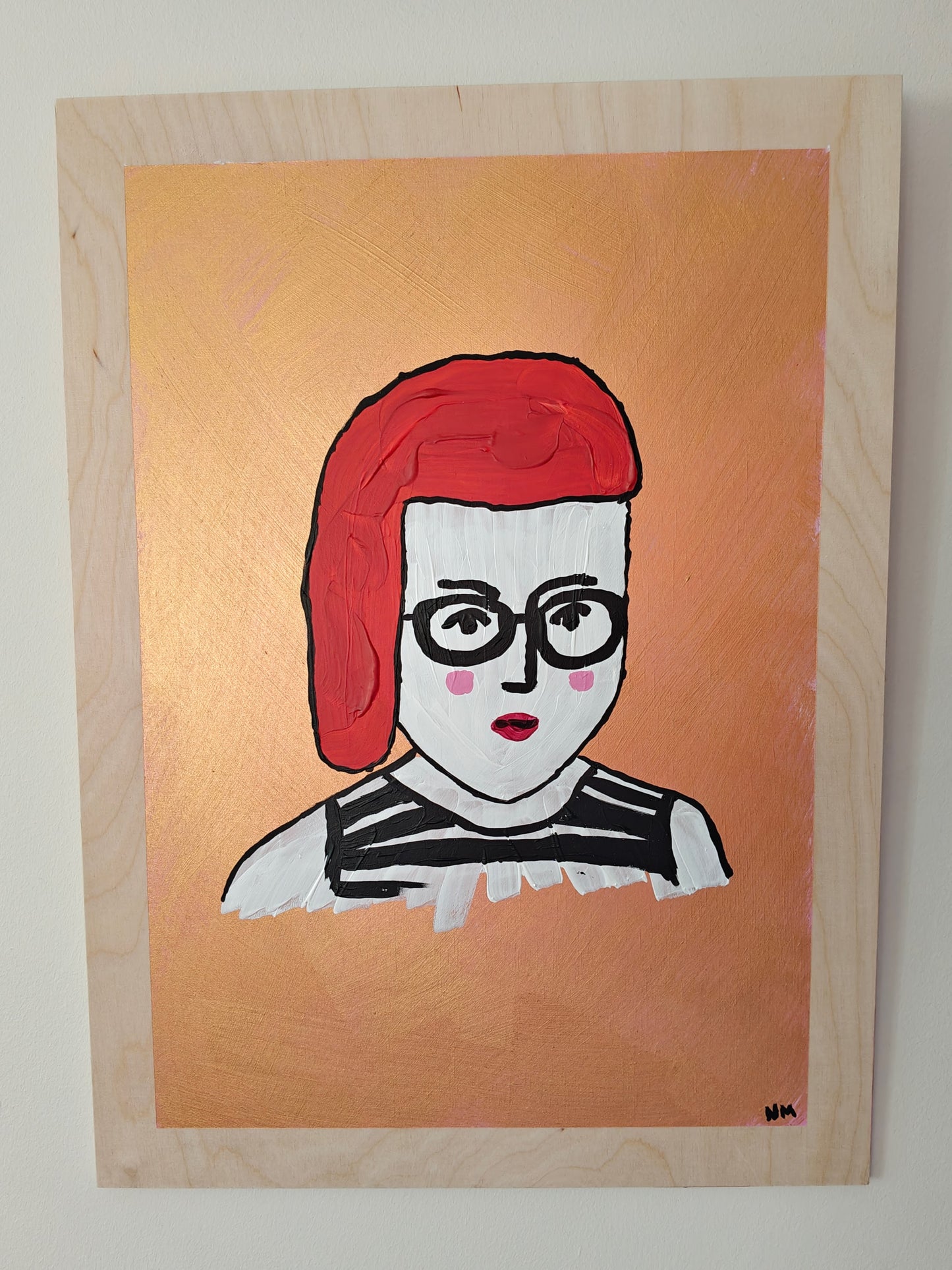 A colorful painting of a woman with red hair, black glasses, and a striped top, set against a gold metallic background, painted on light coloured natural plywood.