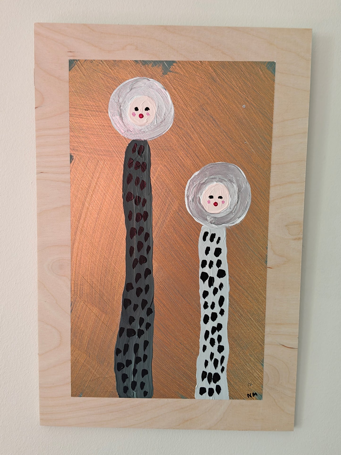 A playful painting featuring two tall, abstract figures with dotted bodies and round, expressive faces. The background has a metallic copper tone, contrasting with the natural plywood that the image has been painted on. Part of the Life in Colour collection.