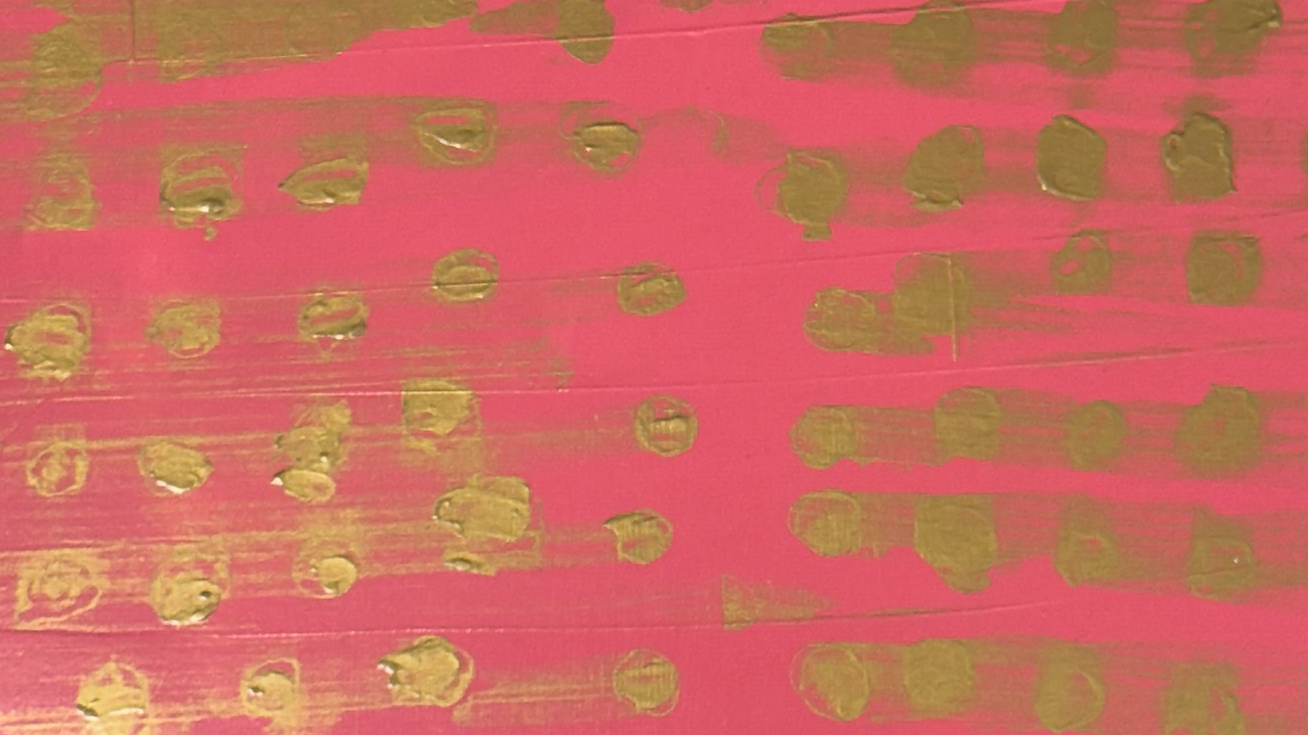 Close up of Plywood side table with hand-painted unique design in pink and gold. Top view