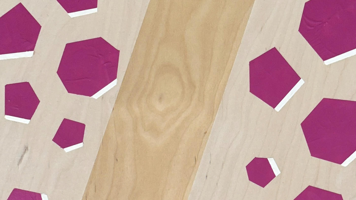 Plywood side table with hand-painted unique design in pink and white. Top view