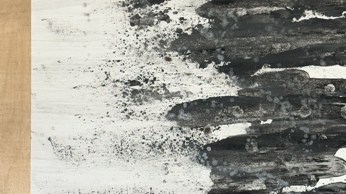 Plywood side table with hand-painted unique design in black, silver and white. Top view